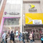 T-Mobile and a former Sprint cellular phone store adjoin each other in Herald Square in New York. (Richard B. Levine / Sipa USA)