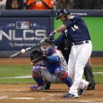 The Brewers Domingo Santana hits a two-run double during Game 1 of the National League Championship Series against the Dodgers on Oct. 12, 2018, in Milwaukee. The Mariners acquired Santana on Friday. (AP Photo/Charlie Riedel)