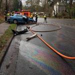 Oil is visible on the road in the 4000 block of 164th Street Southwest in Lynnwood. The slick roadway may have contributed to a head-on crash there Dec. 23. (South Snohomish County Fire & Rescue)