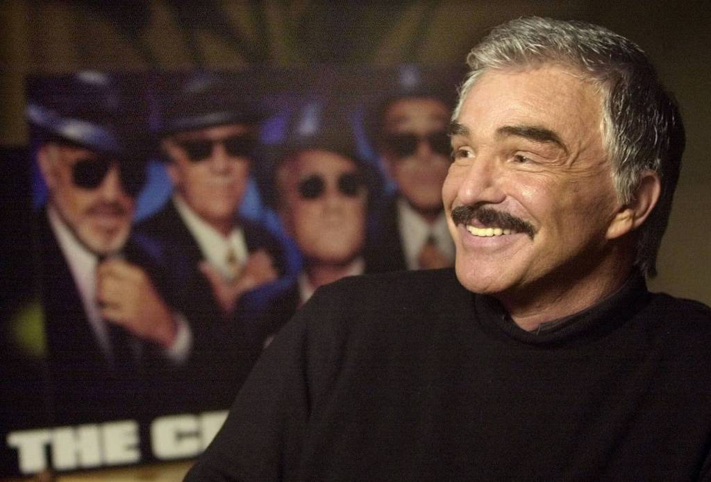 Actor Burt Reynolds talks about his new movie The Crew and his character Joey The Bats Pistella from his hotel suite at the Loews Miami Beach Hotel on Aug. 20, 2000. (AP Photo/Amy E. Conn)