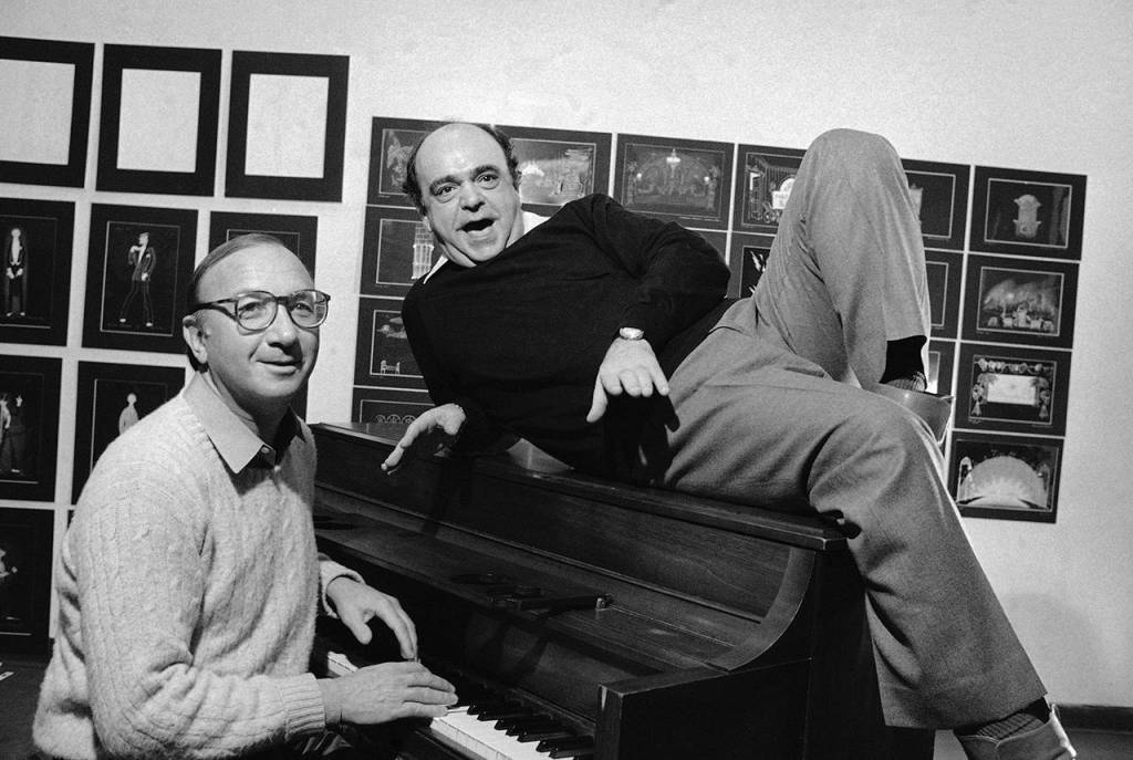 In this Nov. 23, 1981 photo playwright Neil Simon (left) and actor James Coco pose for a photo in New York during the New York announcement of a Broadway bound musical comedy, Little Me. (AP Photo/Lederhandler, File)