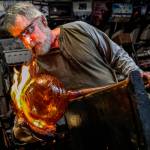 Mark Ellinger works to create unique texture and color on a float. (Dan Bates / The Herald)