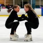 In Susannah Hall McAllisters Everett Figure Skating Club class, students Maddie Grace Moore, 10 (left) and Logan Stephenson, 10, hold hands and skate in circles. (Dan Bates / The Herald)