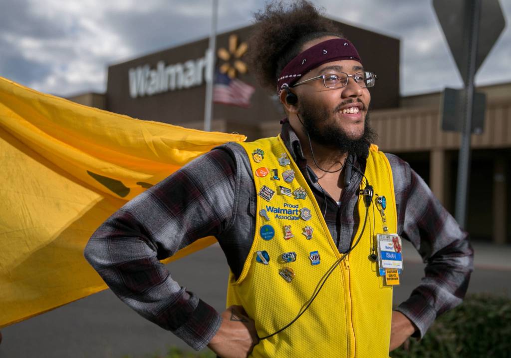Isaiah Owens, a 4-year employee of Walmart, volunteered to wear a cape as part of the back-to-school season and continued the accessory after the promotion was over. (Kevin Clark / The Herald)