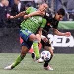 Sounders midfielder Henry Wingo (left) vies for the ball with Los Angeles defender Joo Moutinho on the Xbox Pitch at CenturyLink Field on March 4 in Seattle. Los Angeles FC won 1-0. (Kevin Clark / The Daily Herald)