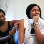 Nichelle Crawford (left) gives her daughter, Kia Crawford, her multiple sclerosis seizure prevention injection at their home in Lynnwood on May 9. (Kevin Clark / The Herald)