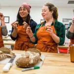Graduate students from Tufts University, Tetyana Pecherska, Nayla Bezares, Claire Loudis and Test Baker Julia Bernstein, right, smell, feel and taste salted and unsalted breads at The Bread Lab in Burlington. (Andy Bronson / The Herald)