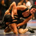 Kamiaks Sarah Giovi (right) wrestles Cascades Nadia Diaz Luna at Mariner High School in Everett on Dec. 19. (Kevin Clark / The Herald)