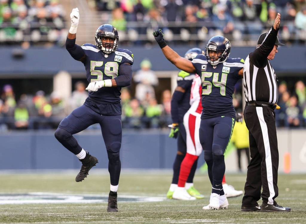 Seattles Jake Martin celebrates stopping the Cardinals on a fourth down play during the Seahawks 27-24 win over Arizona on Sunday at CenturyLink Field in Seattle. (Andy Bronson / The Herald)
