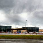 Workers continue to put finishing touches on the new Paine Field passenger terminal at the Snohomish County Airport Thursday. Commercial flights will start next month from the terminal, which is owned by Propeller Airports. (Dan Bates / The Herald)