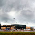 Workers continue to put finishing touches on the new Paine Field passenger terminal at the Snohomish County Airport Thursday. Commercial flights will start next month from the terminal, which is owned by Propeller Airports. (Dan Bates / The Herald)