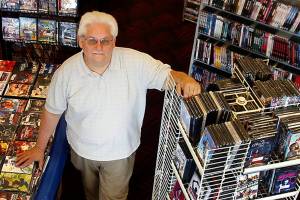 Perry Irvine opened Silver Lake Video in 1985 with VHS and Beta tapes. He is closing up shop and selling off the remaining 25,000 discs. The last day is Jan. 12. (Dan Bates / Herald file)