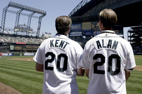 Popular radio hosts Kent and Alan thow the ball before a Seattle Mariners game. (Contributed photo)