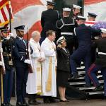 He’s the 6-foot-4 Marine in photos of Bush’s memorial services