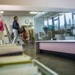 Volunteers help move and unpack boxes at the Edmonds Senior Centers new thrift store. (Olivia Vanni / The Herald)
