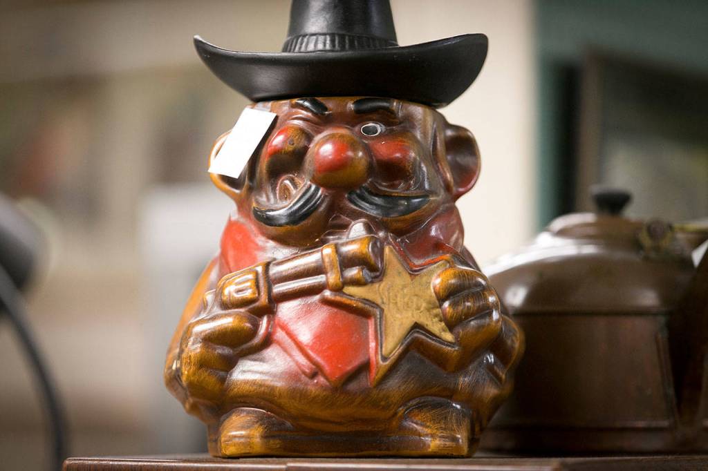 An Old Weest sheriff cartoon figurine on display at the Star Center Antique Mall. (Kevin Clark / The Herald)