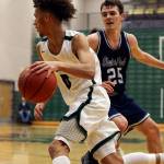 Jacksons Christian Liddell (left) controls the ball with Glacier Peaks Noah Forman defending during a game on Jan. 4 at Henry M. Jackson High School in Mill Creek. (Kevin Clark / The Herald)