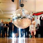 The partygoers line up at the Carl Gipson Senior Center in Everett during the New Years Eve party Dec. 31 to watch the glass ball lower to the floor during countdown. (Dan Bates / The Herald)