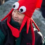 Sho Fuji sports a squid hat as he waits to enter the chilly Puget Sound waters at the annual <a href="https://www.heraldnet.com/news/edmonds-polar-bear-plunge-tests-will-refreshes-the-mind/" target="_blank">Polar Bear Plunge</a> at Bracketts Landing on Jan. 1 in Edmonds. (Andy Bronson / The Herald)