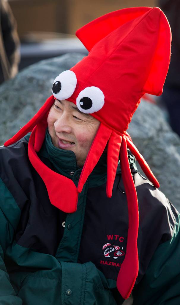Sho Fuji sports a squid hat as he waits to enter the chilly Puget Sound waters at the annual <a href="https://www.heraldnet.com/news/edmonds-polar-bear-plunge-tests-will-refreshes-the-mind/" target="_blank">Polar Bear Plunge</a> at Bracketts Landing on Jan. 1 in Edmonds. (Andy Bronson / The Herald)