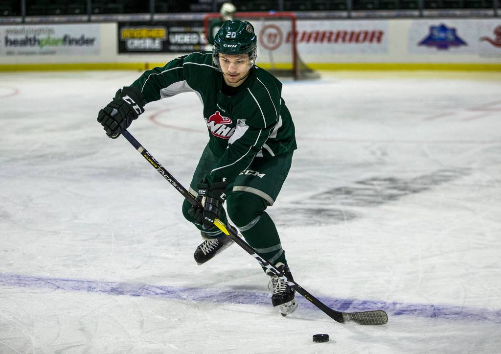 Zach Andrusiak skates with the puck during Silvertips practice on Jan. 2 in Everett. (Olivia Vanni / The Herald)