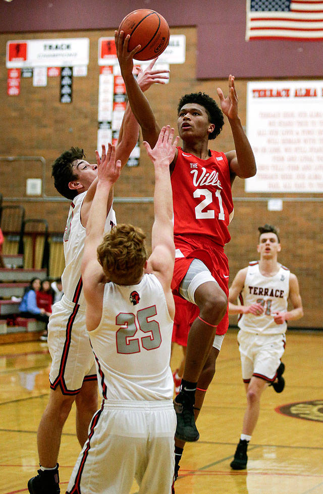 Marysville Pilchucks RaeQuan Battle goes up for a layup during a Wesco 3A boys basketball game Monday in Mountlake Terrace. Battle scored 25 points in the Tomahawks 51-42 win over the Hawks. (Andy Bronson / The Herald)