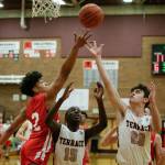 Marysville Pilchucks Alec Jones-Smith (left) battles Mountlake Terraces Jeffrey Anyimah (15) and Robbie Baringer for a rebound during a Wesco 3A game Monday in Mountlake Terrace. Jones-Smith and the Tomahawks won 51-42. (Andy Bronson / The Herald)