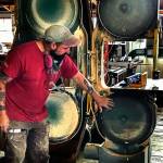 Chuck Gittings, a former manager at the Center for Wooden Boats at Cama Beach, teaching kids about the band saw. (Contributed Photo)