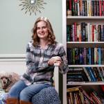 The Puritan Coven series by Jennifer Bardsley (aka Louise Cypress) kicks off with Bite Me. Shes seen here in her Edmonds home with Merlin the poodle. (Andy Bronson / The Herald)