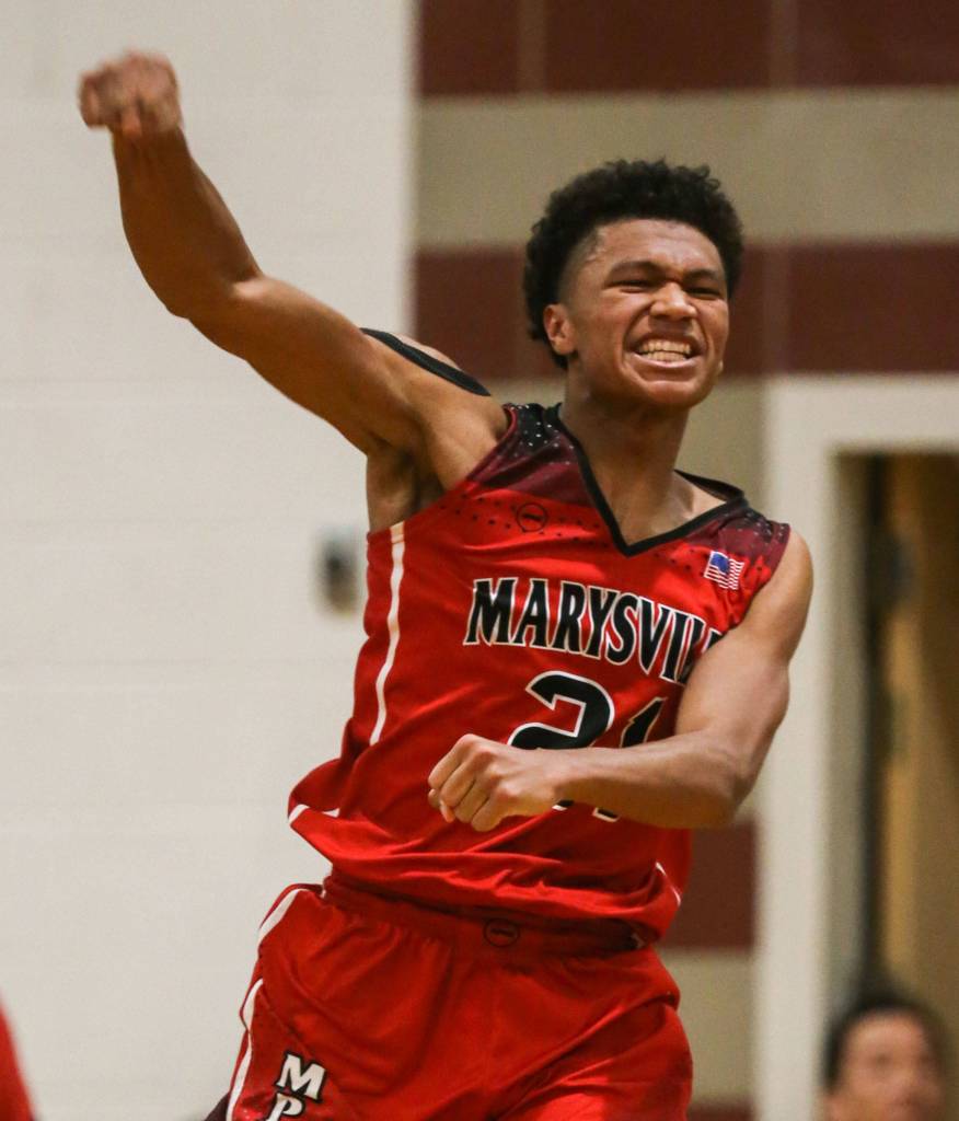 Marysville-Pilchucks RaeQuan Battle celebrates his game-winning basket December 14, 2018, at Edmonds-Woodway High School in Edmonds. (Kevin Clark / The Herald)