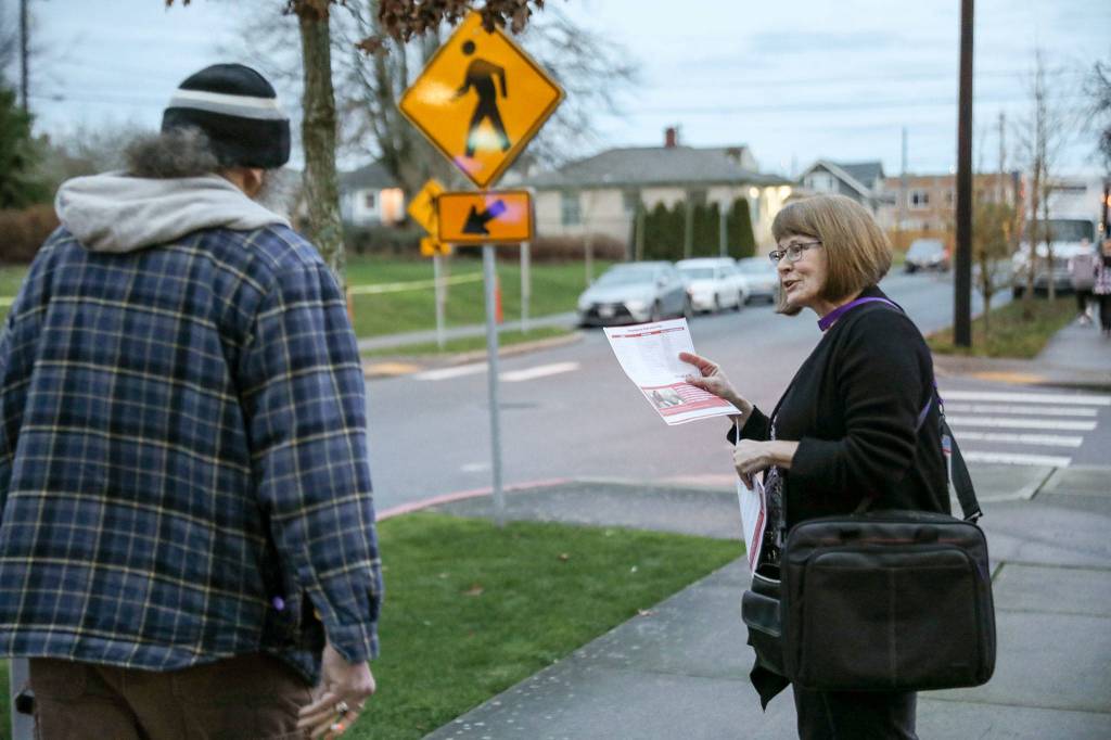Beeja Lane, a nurse with Providence Hospice and Homecare of Snohomish County, participated in the rally last week handing out fliers outside Providence Regional Medical Center Everett on Jan. 10. (Lizz Giordano / The Herald)