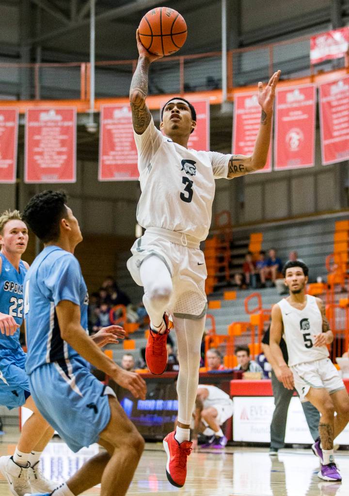 Markieth Brown jumps for a layup during the game against Spokane on Dec. 29 in Everett. (Olivia Vanni / The Herald)