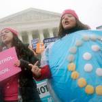 Margot Riphagen of New Orleans, Louisiana, wears a birth control pills costume during a protest in front of the U.S. Supreme Court in Washington on March 25, 2015. (AP Photo/Charles Dharapak, File)