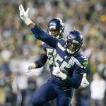 Frank Clark of the Seattle Seahawks signals to the crowd after sacking Green Bay quarterback Aaron Rodgers during an NFL game on Nov. 15, 2018, in Seattle. (Andy Bronson / The Herald)