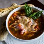 Pasta Fagioli with fresh breadsticks, basil and shredded parmesan cheese. (Olivia Vanni / The Herald)