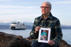 Rosemary Newman holds a photo of her mother, Hazel Mae Nichols, whose ashes were dispersed during a memorial service on the Edmonds-Kingston ferry route. (Olivia Vanni / The Herald)