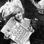 In this June 11, 1967 photo, Carol Channing holds a sold out advertisement poster of Hello, Dolly in Houston. Channing, whose career spanned decades on Broadway and on television has died at age 97. Publicist B. Harlan Boll says Channing died of natural causes early Tuesday in Rancho Mirage, California. (AP Photo/Ed Kolenovsky, File)