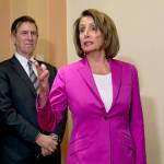 Speaker of the House Nancy Pelosi (right), D-California, with Rep. Don Beyer D-Virginia, talks to reporters Friday after passage of a House bill requiring that government workers receive retroactive pay after the partial shutdown ends. (AP Photo/J. Scott Applewhite)