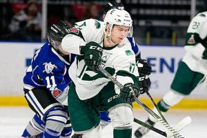 Everetts Matt Fonteyne controls the puck with Victorias Matthew Phillips giving chase at Angels of The Winds Arena Sunday night on January 7, 2018. championship. Silvertips won 9-4. (Kevin Clark / The Daily Herald)