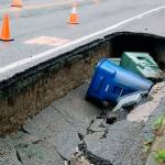 Large sinkholes appear on road after water main breaks