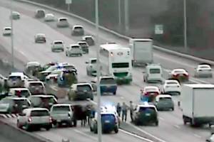 Law enforcement vehicles at the scene of a crash on I-5 near Northgate in Seattle after a chase that began in Lynnwood on Wednesday. (Washington State Department of Transportation)