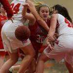 Stanwoods Madeline Larson (center) tries to split the double team set by Snohomishs Kaylin Beckman (left) and Courtney Perry (right) during a Wesco 3A girls basketball game Thursday in Snohomish. Snohomish (10-6, 9-1 Wesco 3A) locked down Stanwood (9-7, 6-4) during an 18-4 second quarter on its way to its fourth straight win. Maya DuChesne scored a game-high 16 poitns for the Panthers. (Kevin Clark / The Herald)