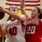 Snohomishs Courtney Perry (left) attempts a shot with Sranwoods Gabriella Green defending during a Wesco 3A girls basketball game Thursday in Snohomish. Perry scored 11 points in the Panthers 55-38 win. (Kevin Clark / The Herald)
