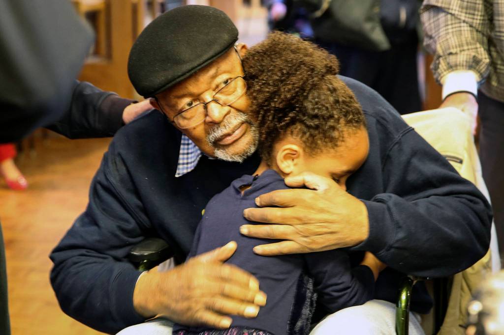 Carl Gipson gets a hug from his great-granddaughter, MyElli Richards, 4, during his birthday party at Carl Gipson Senior Center in Everett on Jan. 12, 2019. (Kevin Clark / The Herald)