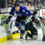 Silvertips Jake Christiansen is knocked down during the game against the Victoria Royals on Sunday, Jan. 20, in Everett. (Olivia Vanni / The Herald)