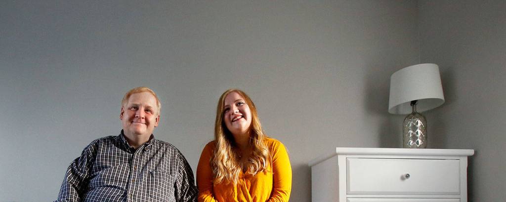 Senior Pastor John Stima of Monroe Baptist Church sits with his daughter Lizzy admiring one of the newly renovated rooms in Dorothys House. The Monroe facility will provide temporary living quarters for pregnant women in need. (Dan Bates / The Herald)