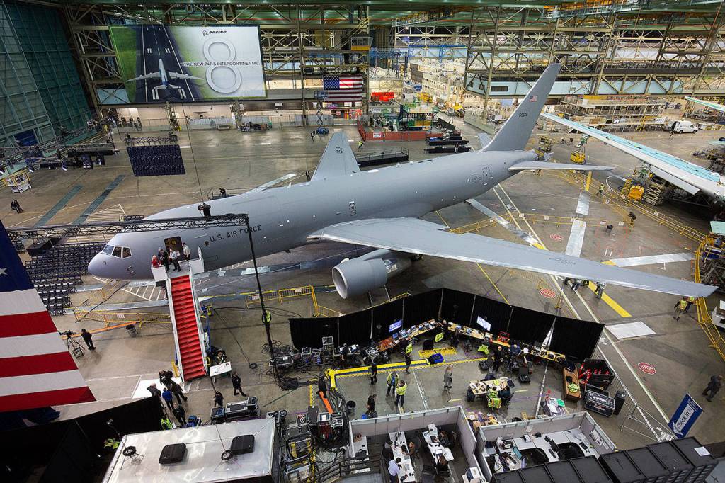 Boeing workers get in place for the KC-46 Pegasus delivery event in the Boeing factory at Paine Field in Everett on Thursday. (Andy Bronson / The Herald)