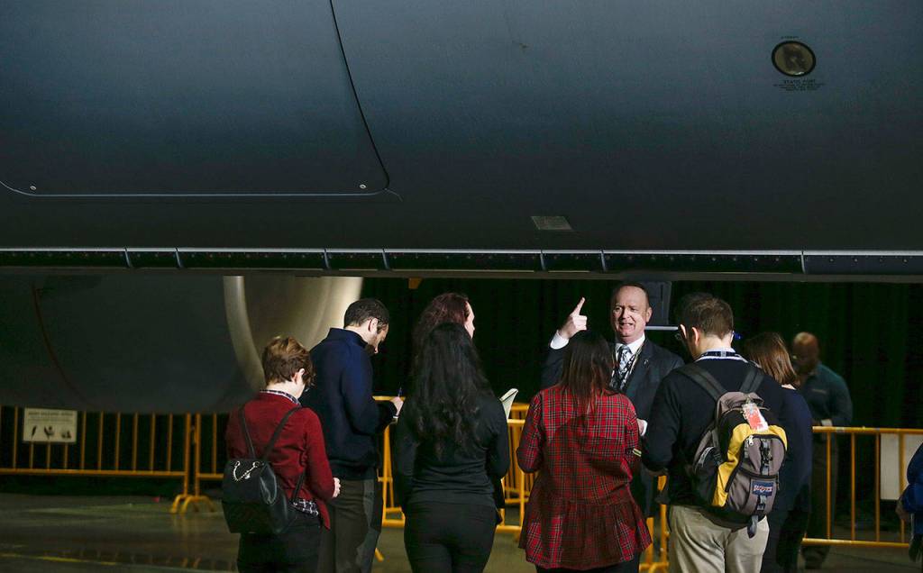 Mike Hafer, Boeings senior manager for KC-46 business development., explains features of the KC-46 Pegasus tanker to reporters before the start of a delivery ceremony in the Boeing factory at Paine Field in Everett on Thursday. (Andy Bronson / The Herald)