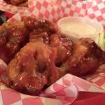Chicken wings with a Korean BBQ sauce over them are a tasty mix of sweet with a small bite of spice to them at That Chicken Place in Everett. (Ben Watanabe / The Herald)