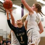 Glacier Peaks Haley Grambo attempts a shot while splitting Lake Stevens defenders Kaylie Bracy (left) and Cori Wilcox during the Grizzlies 67-48 win over the Vikings on Tuesday night at Lake Stevens High School. (Kevin Clark / The Herald)